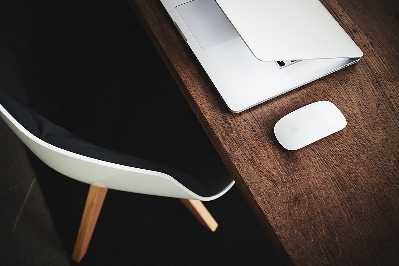 A laptop on a desk illustrating remote work on MM2H in Malaysia