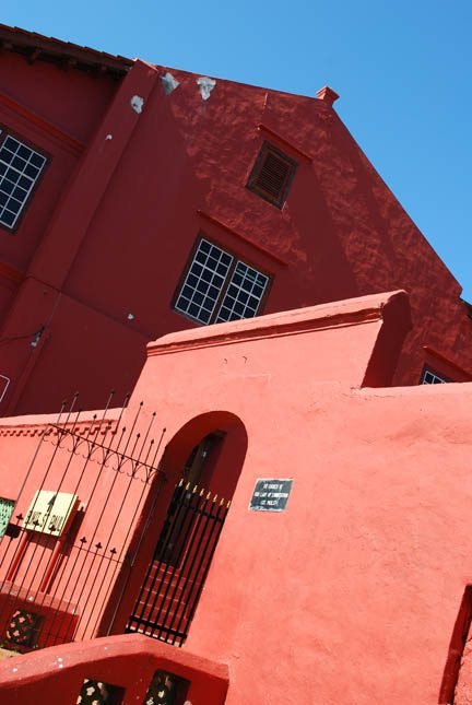 Historic red buildings in Malacca representing the MM2H old programme legacy